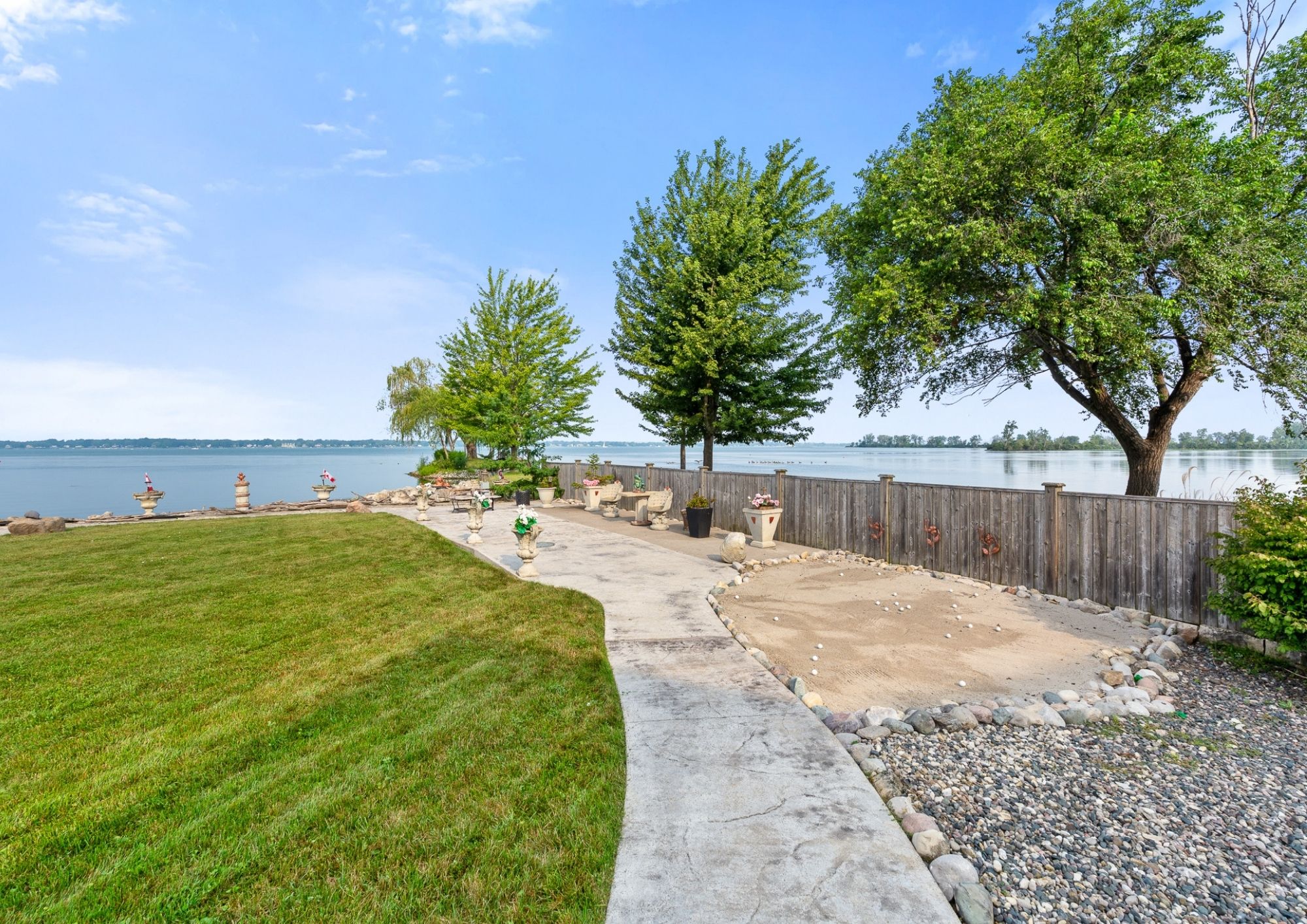 Exterior view of 1360 Windermere Place and its waterfront setting
